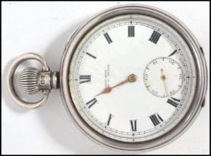 An early 20th century silver hallmarked pocket watch having crown winder and loop bale to top with