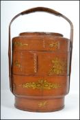 An early 20th century Oriental sectional wooden rice cooker / storage pot having gilt decoration
