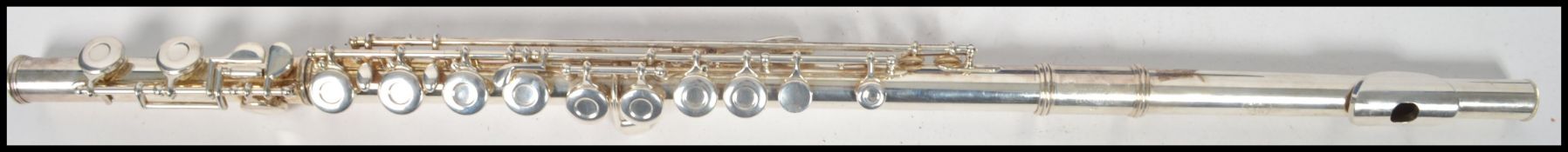 A vintage Gemeinhardt Elkhart flute complete in original fitted case. Measures 67 cm long.