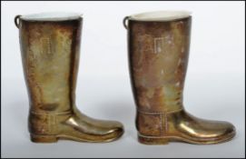 A pair of 20th century silver plated boot measures for spirits. Complete with the white inner