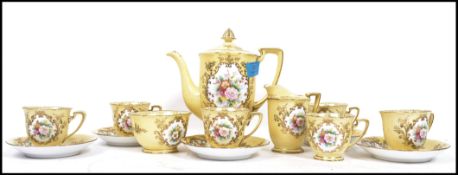 An early 20th century Noritake tea service decorated in a famille Juan ground with hand painted