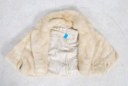 A vintage mid 20th century fur cape by Richard Payne with makers name to the interior.