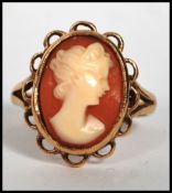 A 9ct gold cameo ladies ring. The 9ct shank with pierced shoulders havinga central cameo of a