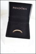A 14ct gold and diamond Pandora eternity ring complete in original box with presentation gift bag.