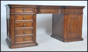 A good reproduction large mahogany antique style twin pedestal desk the inverted breakfront having