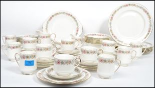 A 20th century Royal Albert dinner and tea service on the Belinda pattern consisting of coffee cans,