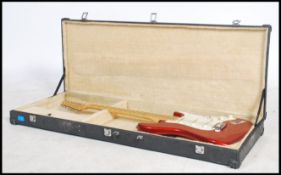 Musical Instruments. A 20th century Semick electric guitar in red and white complete in the original