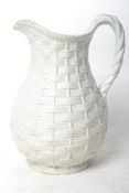 A 19th century Victorian Parian ware jug having a textured basket ware design. Victorian lozenge