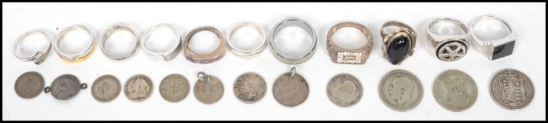 A collection of eleven silver and white metal rings together with a small collection of 19th century
