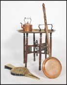 An early 20th century metamorphic Anglo - Indian folding brass occasional table together with a pair