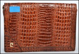 A vintage Pierre Cardin retro alligator skin ladies clutch handbag with multiple zipped compartments