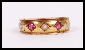A vintage early 20th century 15ct hallmarked gold gypsy ring set with seed pearls and ruby