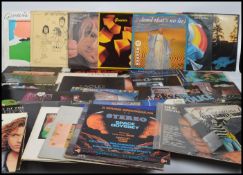 A collection of vinyl long play LP albums by varios artists to include INXS, Genisis, Alex Harvey,