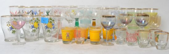 A collection of retro mid 20th century vintage drinking glassware to include a set of banded