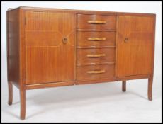 A 1950's mahogany and line inlaid retro sideboard in the manner of Vansen. The sideboard with line