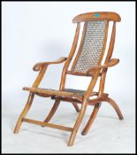 A Victorian 19th century walnut steamer desk chair - campaign chair being upholstered in berfere