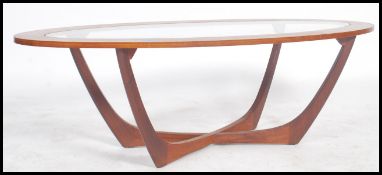 A 1970's teak G Plan style atomic coffee table in