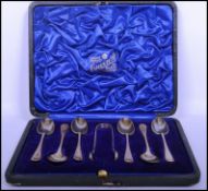 A cased set of silver hallmarked teaspoons and matching sugar nips complete in the presentation