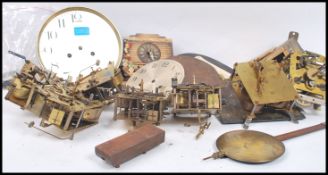A good group of vintage 20th century and other clock spares and repairs to include enamel faces,