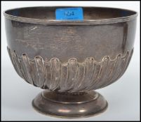 A silver hallmarked pedestal scalloped rose bowl bearing London assay marks, makers marks and date