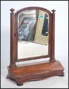 A large Victorian mahogany toilet swing mirrror. Raised on a serpentine hinged base with lift up