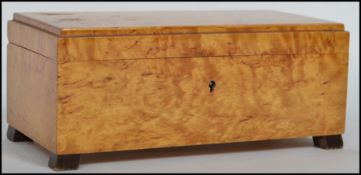 A stunning 1930's Art Deco birds eye maple Jewellery box / casket, fitted with a hinged lid