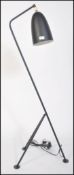 After Greta Grossman, a large black grasshopper floor lamp. Having a tubular steel tripod frame with