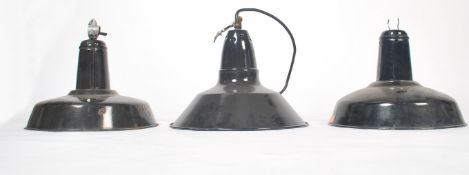 A set of 3 mid century Industrial factory pendant lights of saucer form in a two tone colourway of