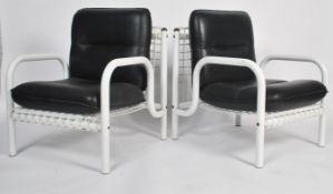 A good pair of French 1970's / 1980's designer armchairs of white tubular metal and cage work