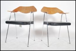 A pair of Italian chrome and walnut panel back laminate carver armchairs in the manner of