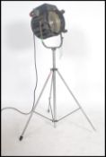 A good 20th century large theatre / cinema film spot light lamp on raised tripod having large
