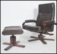 A Danish brown leather reclining swivel chair together with an ottoman / footstool by Kebe both