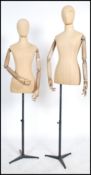 A pair of 20th century shop haberdashery mannequins of female form being linen covered and with