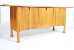 A rare 20th century Ercol ' Saville pattern ' elm sideboard The oversized the plank top raised  over