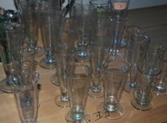 A good collection of medium to large phial measures, each of tapering form with acid etched