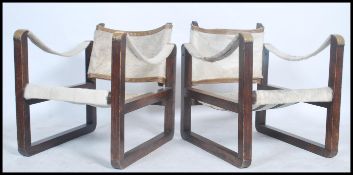 A pair of mid century bentwood and pony hide / skin safari chairs in the manner of Kaare Klint. Each