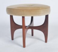 A retro 20th century teak wood circular G-Plan dressing table stool raised on teak wood x-cross base