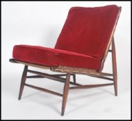 An Ercol ' Windsor ' pattern beech wood open framed chair - armchair. Raised on turned legs with