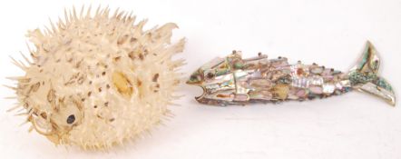 A vintage 20th century taxidermy Puffa fish together with an abalone articulated bottle opener in
