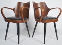An exceptional pair of Danish mid century armchairs in the manner of Cherner for Plycraft. Each