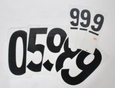 A collection of unusual 20th century American gas station totem pole pricing numers in white with