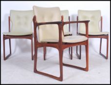 An exceptional set of Danish dining chairs from the mid 20th century being shaped and chamfered to
