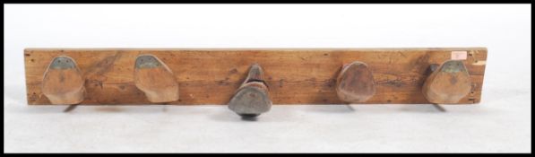 A stunning up-cycled wall mounted coat rack, constructed from cobblers antique wooden shoe