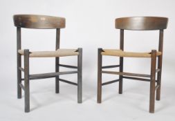 A pair of mid century J39 Danish dining chairs by Borge Mogensen. The chairs on turned legs with
