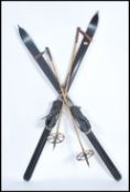 An original set of early 20th century ski's with all the strapping & bindings with leather ski boots