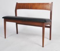 A believed mid century Frem Rojle mid century Danish bench seat being raised on tapering legs with