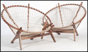 After Hans J Wegner for PP Mobler, a stunning pair of pp130 circle chairs in ash and bound rope