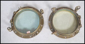 A stunning  early 20th century brass shipping porthole window's with backing plates on  fitted