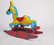 An original 1970's / 1980's fairground attraction ride horse of cast composite form with remains