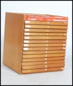 A vintage retro 20th century engineers tool / work cabinet having a 14 drawer bee hive front and